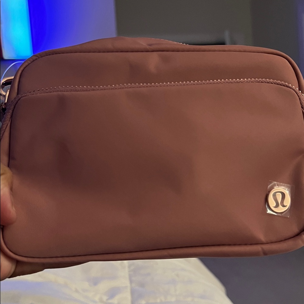 NWT Lululemon Everywhere Belt Bag Pastel Pink with rose gold tone hardware.